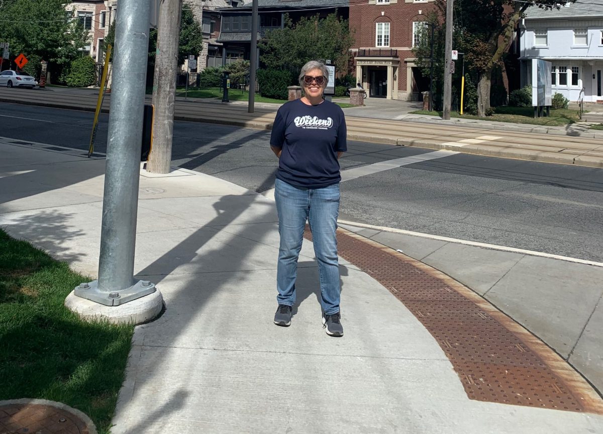 Celia standing on a street corner